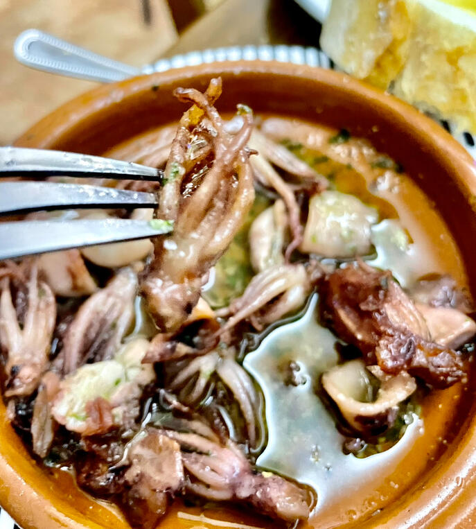 π«Baby squid cazuela - Slow-cooked in garlic, parsley and white wine β the kind of tapa you order twice and dream about after.